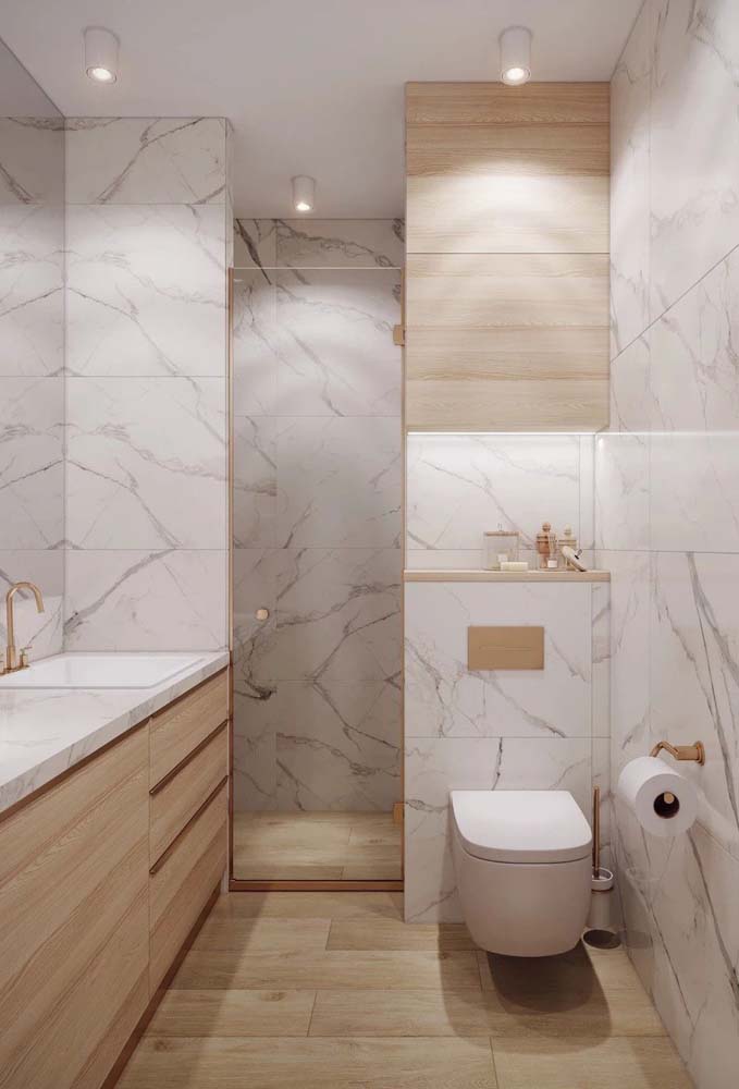 Você não precisa de muito para ter um banheiro sofisticado. Use apenas o porcelanato marmorizado branco