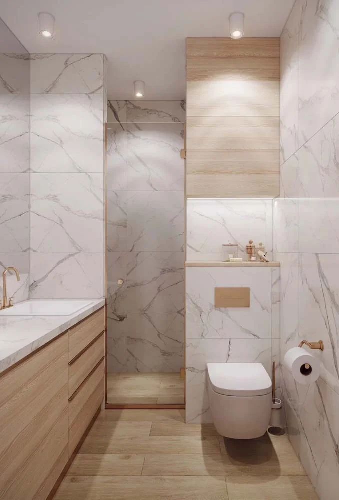Você não precisa de muito para ter um banheiro sofisticado. Use apenas o porcelanato marmorizado branco