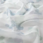 Perdele model floral alb albastru verde din poliester printat Cloud Gardisette latime material 295 cm