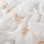 Perdele model grafic alb orange din poliester Curly Gardisette latime material 300 cm