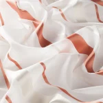 Perdele model in dungi alb argintiu orange din poliester voal Editha Vol.2 Gardisette latime material 280 cm