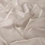 Perdele model uni maro din poliester voal Cora 300 Vol. 2 Gardisette latime material 300 cm