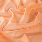 Perdele model uni orange din poliester voal Cora 300 Vol. 2 Gardisette latime material 300 cm